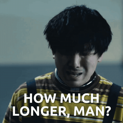 A Man In A Yellow And Brown Striped Shirt Is Crying And Asking How Much Longer Man GIF