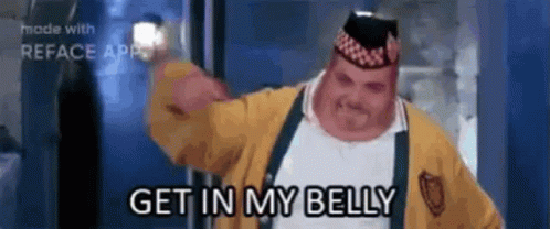 A Man In A Yellow Jacket And Hat Is Saying Get In My Belly GIF