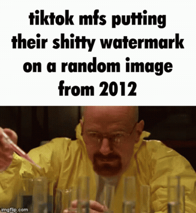 A Man In A Yellow Jacket Is Holding A Pipette In Front Of A Bunch Of Test Tubes GIF