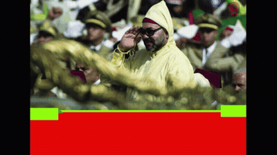 A Man In A Yellow Jacket Salutes In Front Of A Crowd Of People GIF
