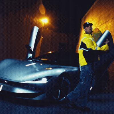 A Man In A Yellow Jacket With The Letter B On It GIF