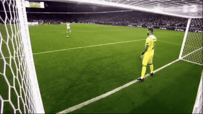 A Man In A Yellow Jersey With The Number 11 On It Is Standing On A Soccer Field GIF