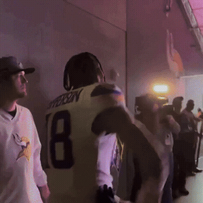 A Man In A Yellow Jersey With The Number 18 On The Back GIF