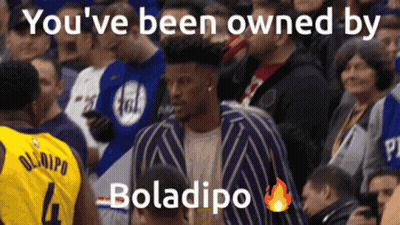 A Man In A Yellow Jersey With The Number 4 Stands In The Crowd GIF