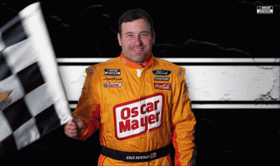 A Man In A Yellow Oscar Mayer Jacket Holds A Checkered Flag GIF