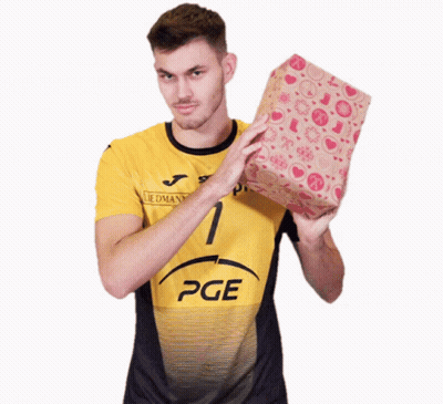 A Man In A Yellow Pge Shirt Holds A Gift GIF