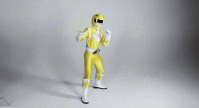 A Man In A Yellow Power Ranger Costume Is Dancing GIF