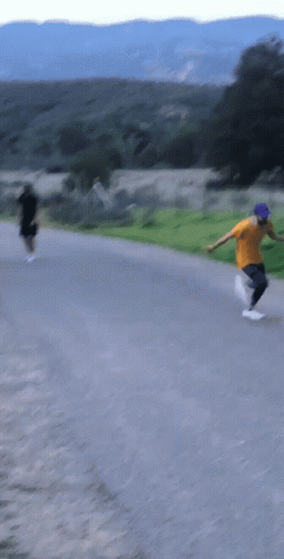 A Man In A Yellow Shirt And Blue Hat Is Running GIF