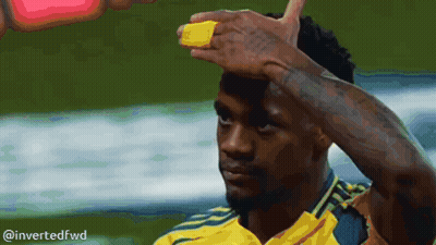 A Man In A Yellow Shirt Has A Yellow Band On His Forehead GIF