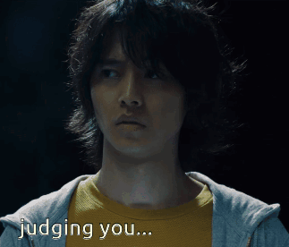 A Man In A Yellow Shirt Is Being Judged By Someone GIF