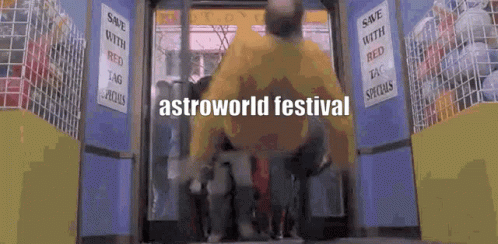 A Man In A Yellow Shirt Is Entering A Store With The Words Astroworld Festival On The Bottom GIF