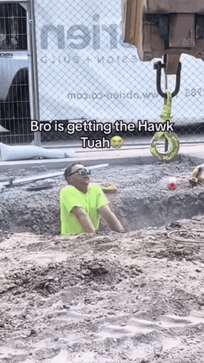 A Man In A Yellow Shirt Is Getting The Hawk Tuan GIF
