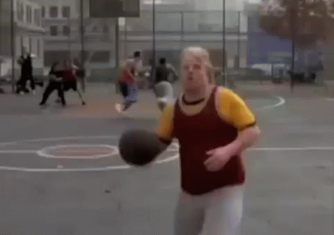 A Man In A Yellow Shirt Is Holding A Basketball In His Hands While Playing Basketball . GIF