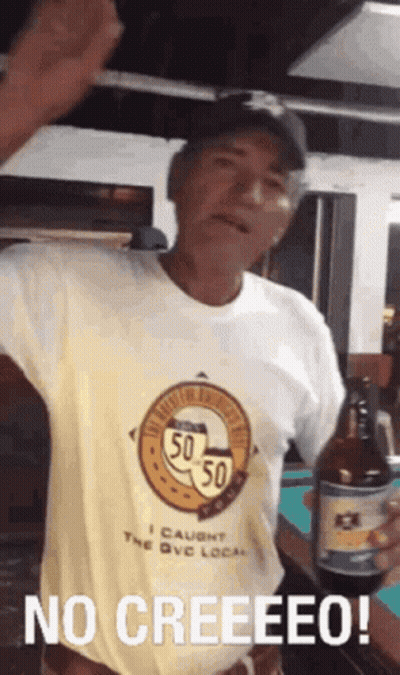 A Man In A Yellow Shirt Is Holding A Bottle Of Beer And Says No Creeeeeo ! GIF