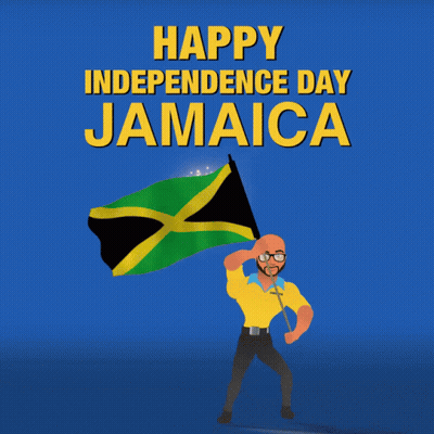A Man In A Yellow Shirt Is Holding A Jamaican Flag In Front Of A Fireworks Display That Says Happy Independence Day Jama GIF
