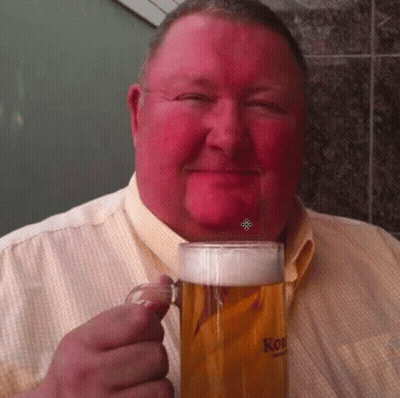 A Man In A Yellow Shirt Is Holding A Mug Of Beer With The Word Kon On It GIF