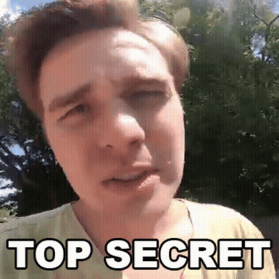 A Man In A Yellow Shirt Is Making A Funny Face And The Words Top Secret Are Above Him GIF