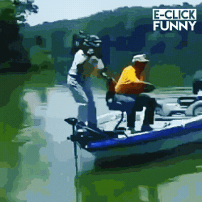 A Man In A Yellow Shirt Is Sitting In A Boat With E-Click Funny Written In The Corner GIF
