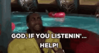 A Man In A Yellow Shirt Is Sitting On A Red Couch In Front Of A Swimming Pool . GIF