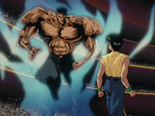 A Man In A Yellow Shirt Is Standing In Front Of A Giant Muscular Man GIF