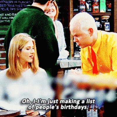 A Man In A Yellow Shirt Is Talking To A Woman In A White Shirt GIF