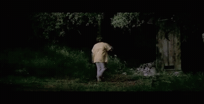 A Man In A Yellow Shirt Is Walking Through A Dark Forest With The Words " It 'S Those Damn Enchiladas " Above Him GIF