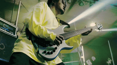 A Man In A Yellow Shirt Plays A Guitar GIF