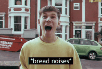 A Man In A Yellow Shirt Says " Bread Noises " In A Video GIF