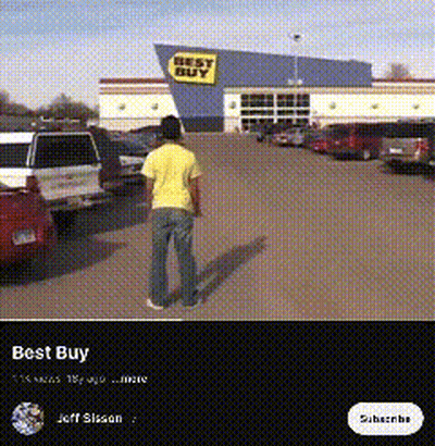 A Man In A Yellow Shirt Stands In Front Of A Best Buy Store GIF