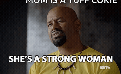 A Man In A Yellow Shirt With A Necklace Says She 'S A Strong Woman GIF