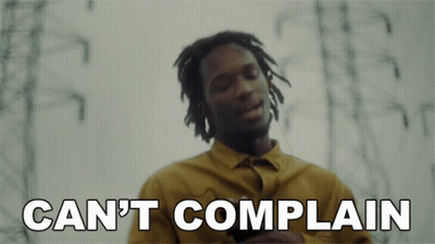 A Man In A Yellow Shirt With The Words Can 'T Complain Below Him GIF