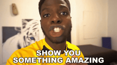 A Man In A Yellow Shirt With The Words Show You Something Amazing Behind Him GIF