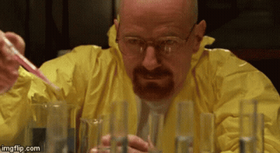 A Man In A Yellow Suit Is Pouring Liquid Into Test Tubes . GIF