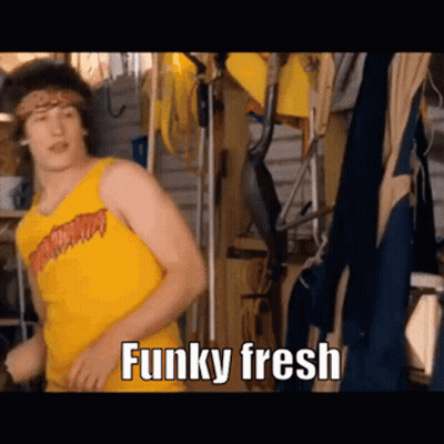 A Man In A Yellow Tank Top Is Dancing In A Garage With The Words `` Funky Fresh '' Written Below Him . GIF