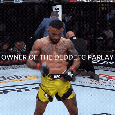A Man In A Yellow UFC Shorts Stands In A Boxing Ring GIF