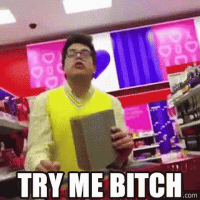 A Man In A Yellow Vest Is Holding A Book In Front Of A Sign That Says Try Me Bitch GIF