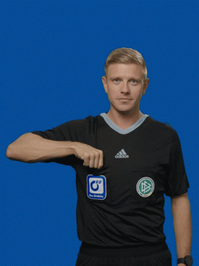 A Man In An Adidas Shirt Is Holding A Yellow Card GIF