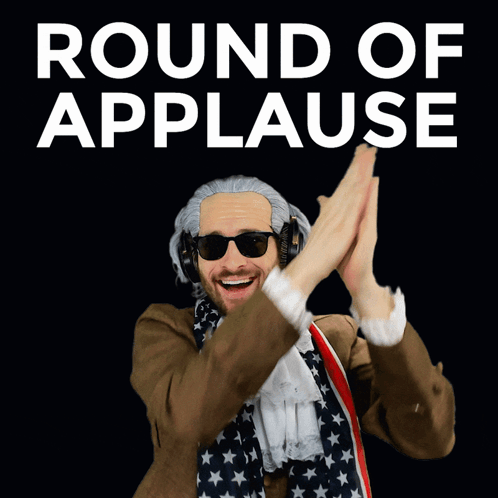 A Man In An American Flag Costume Is Giving A High Five In Front Of A Round Of Applause Sign GIF