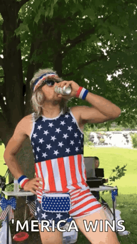A Man In An American Flag Outfit Drinks From A Can And Says " Merica Wins " GIF