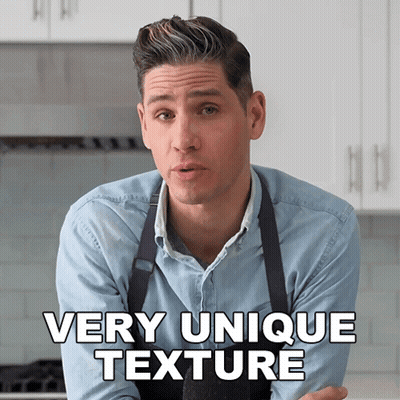 A Man In An Apron Says Very Unique Texture In A Kitchen GIF