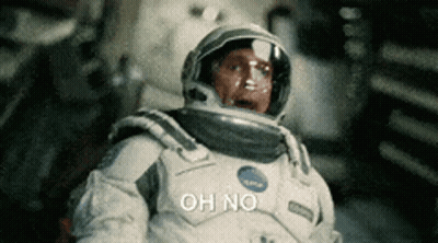 A Man In An Astronaut 'S Suit Is Saying Oh No GIF