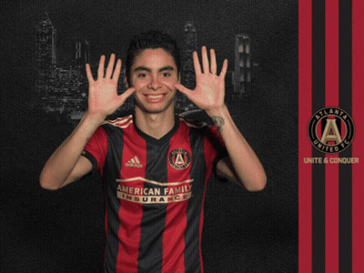 A Man In An Atlanta United Fc Jersey Holds Up His Hands GIF