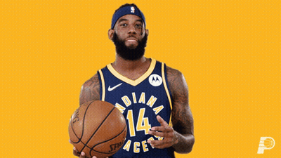 A Man In An Indiana Pacers Jersey Is Holding A Basketball GIF