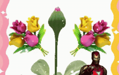 A Man In An Iron Man Suit Stands In Front Of Flowers GIF