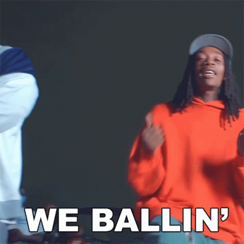 a man in an orange hoodie says we ballin