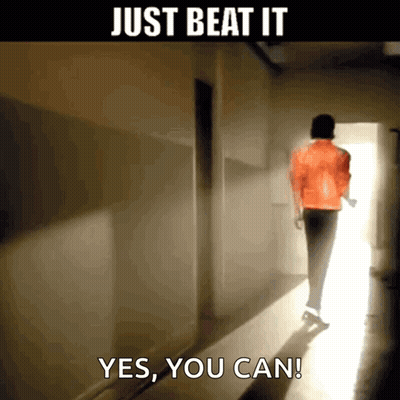 A Man In An Orange Jacket Is Walking Down A Hallway With The Words Just Beat It Yes You Can GIF