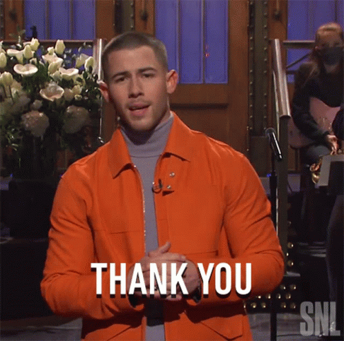 A Man In An Orange Jacket Says Thank You On Snl GIF