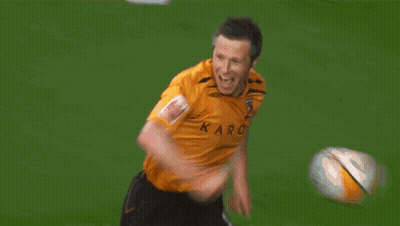 A Man In An Orange Jacket With A Crown Logo On His Arm GIF