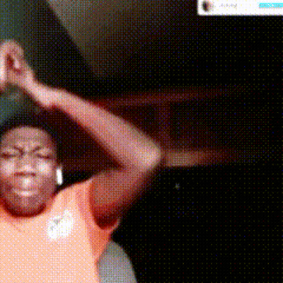 A Man In An Orange Shirt Is Dancing In Front Of A Screen That Says ' Directory ' On It GIF