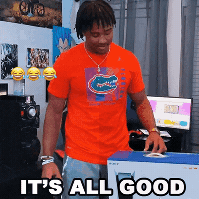 A Man In An Orange Shirt Is Holding A Box That Says It 'S All Good On It GIF